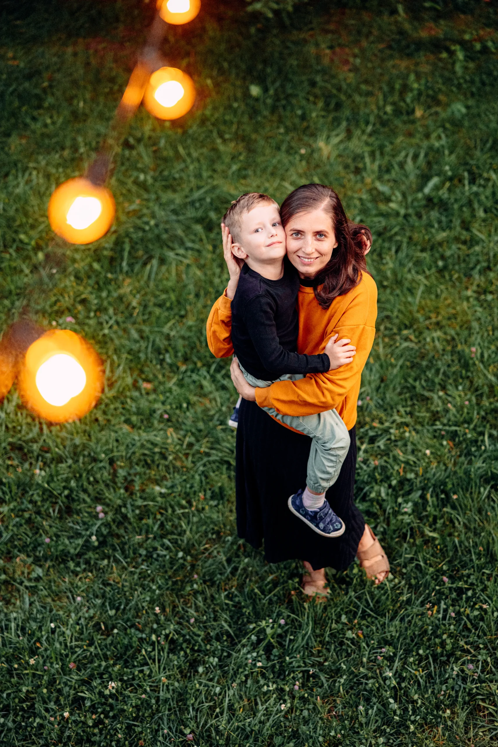 A mother and child looking at the lights.