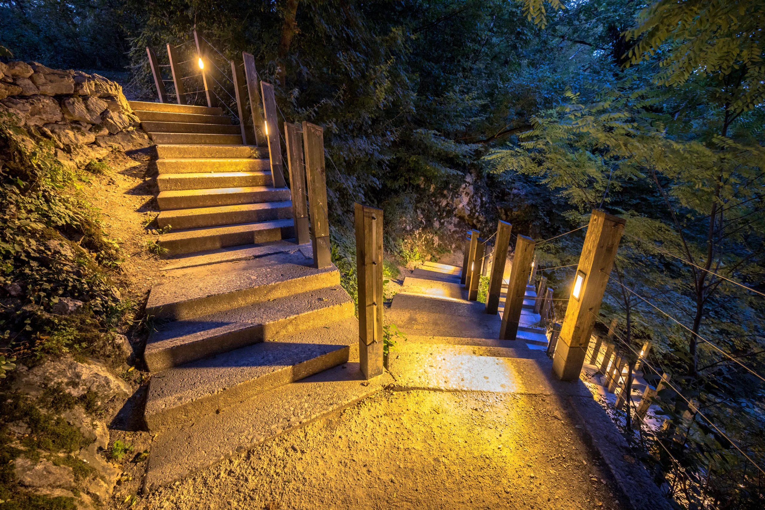 An illuminated outdoor stairway in the park.